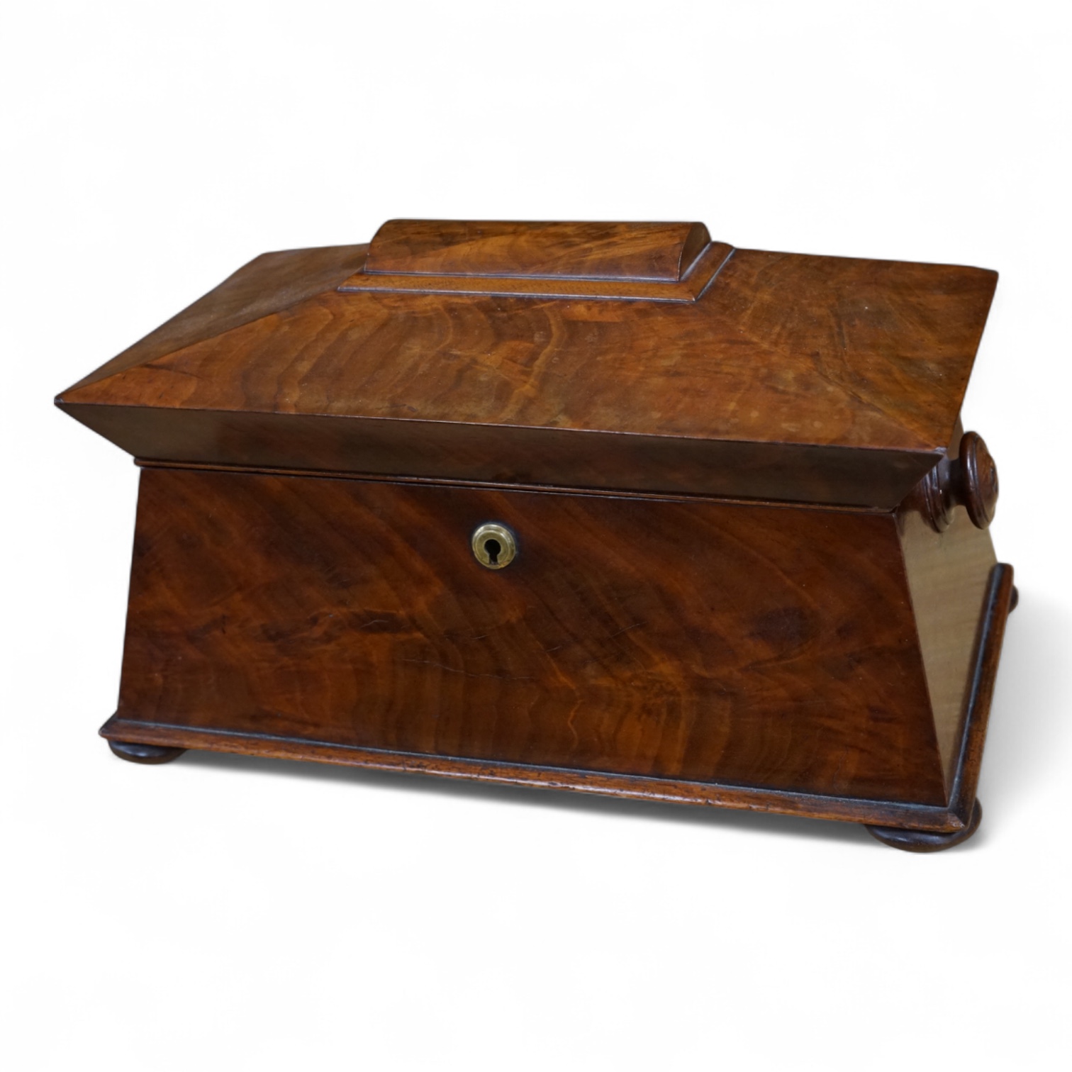 An early Victorian mahogany sarcophagus shaped tea caddy, 35cm wide